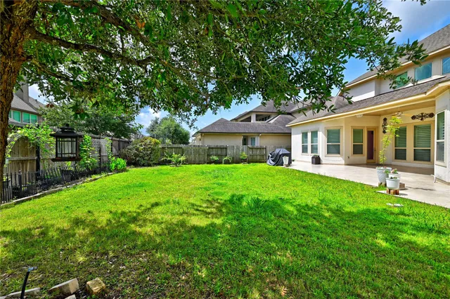 a view of a house with a yard porch and sitting area