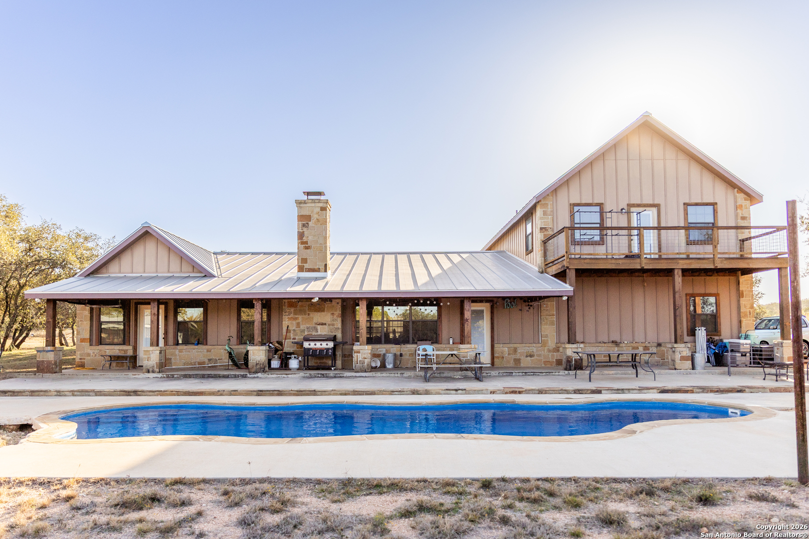 a front view of a house with swimming pool
