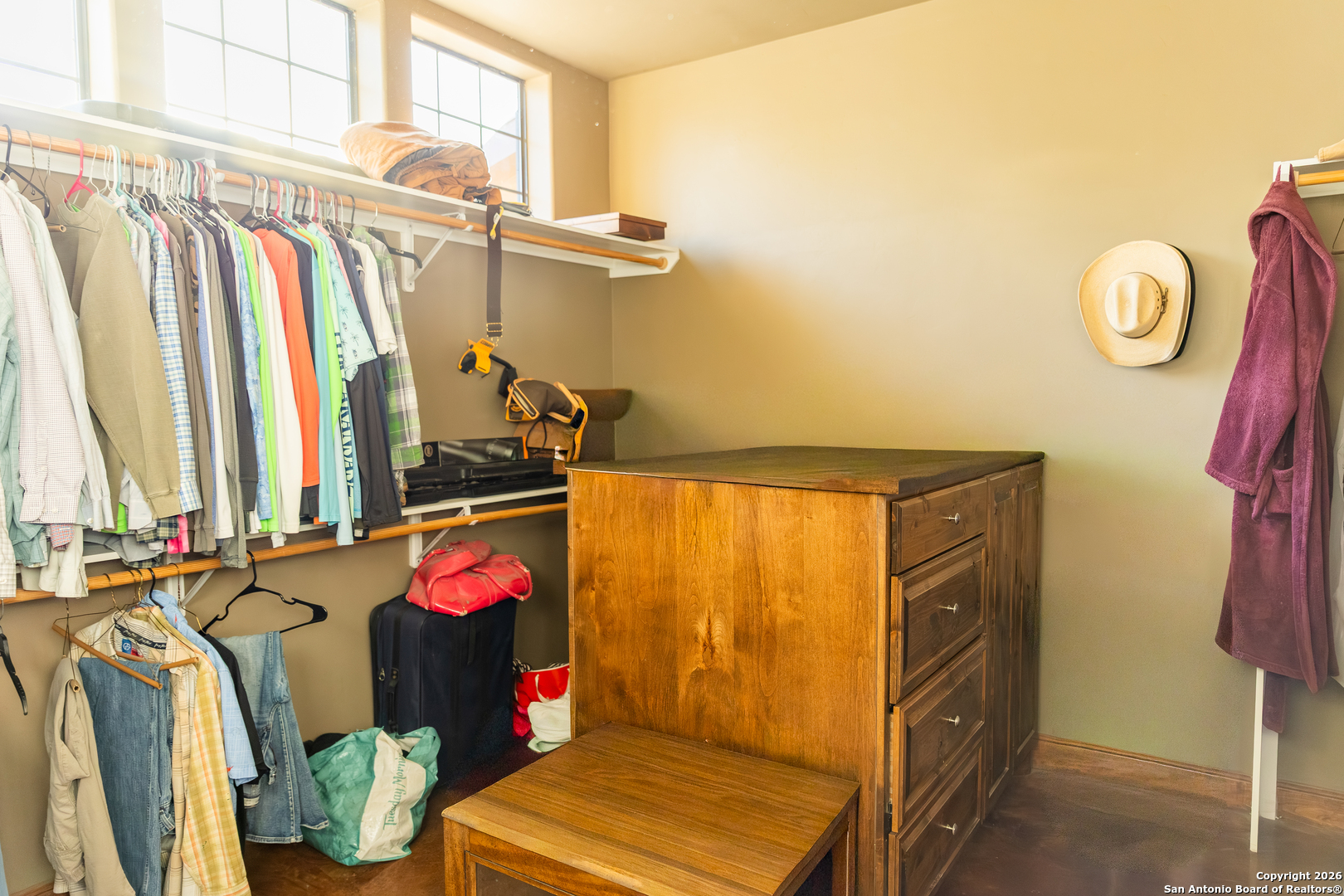 187 Robbins Ranch Road Junction, TX 76849 - Photo 15 of 23 a view of walk in closet with clothes and shoes