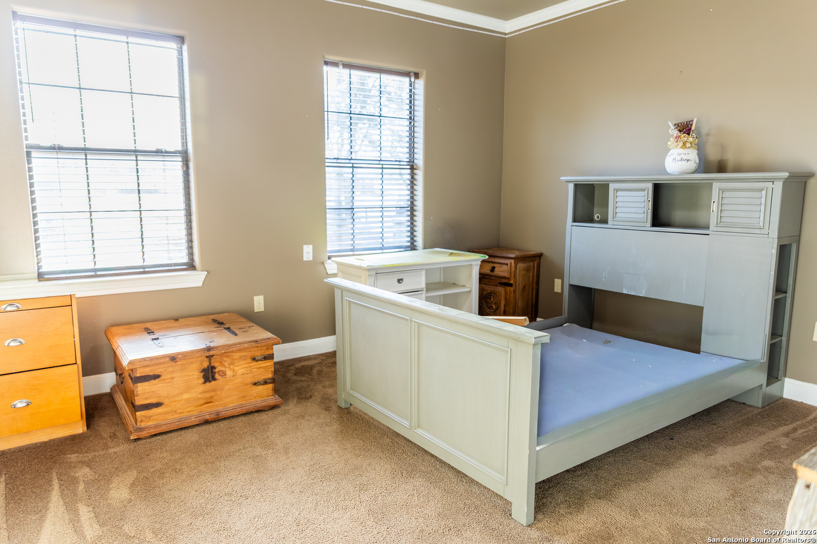 187 Robbins Ranch Road Junction, TX 76849 - Photo 17 of 23 a bedroom with a bed and a window