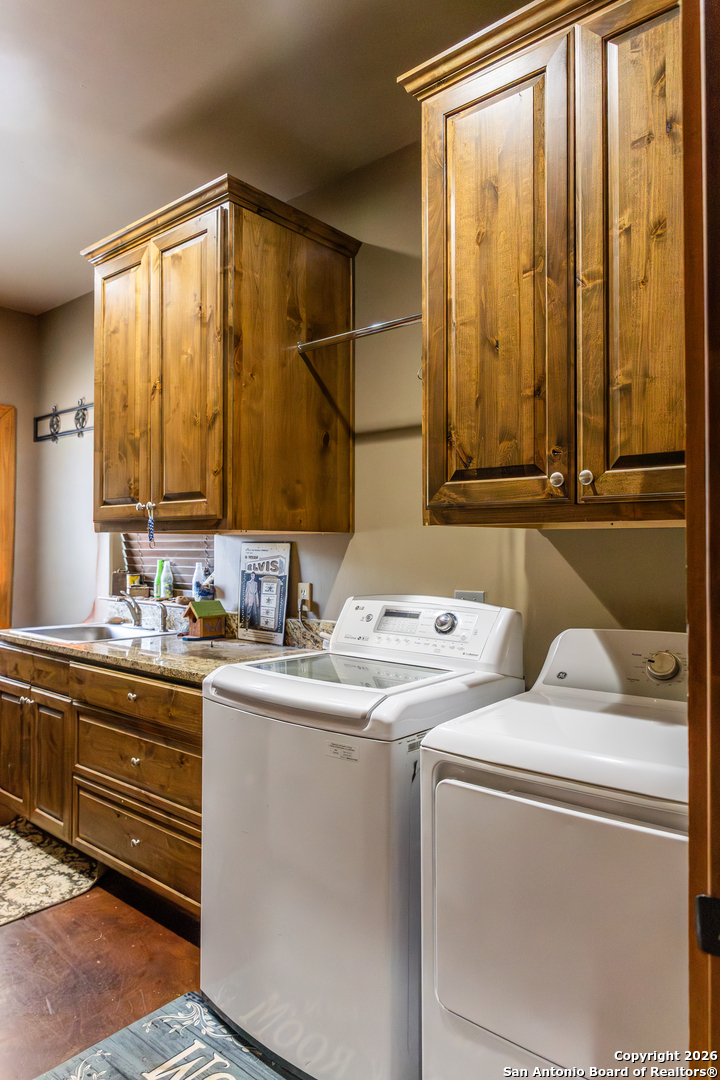 187 Robbins Ranch Road Junction, TX 76849 - Photo 20 of 23 a utility room with dryer and washer