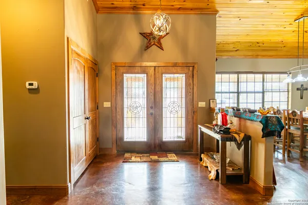 a view of a livingroom with furniture and hardwood floor