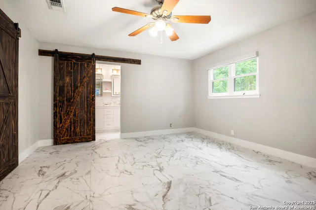 a view of an empty room and window