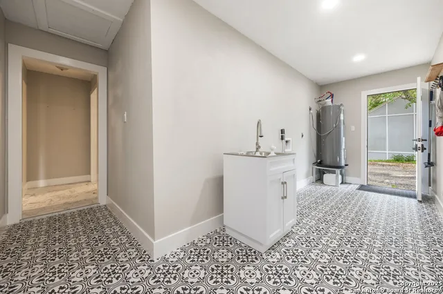 a view of a storage & utility room with closet washer and dryer