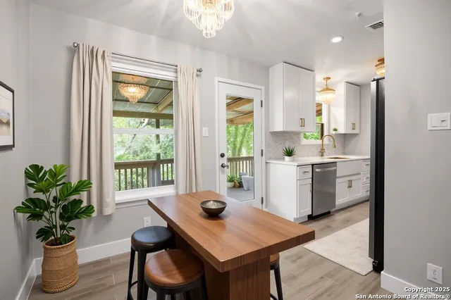 a kitchen with a table and chairs in it