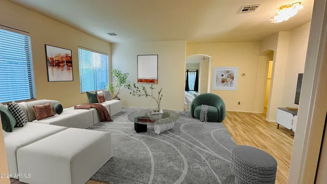 a bedroom with two beds and a large mirror