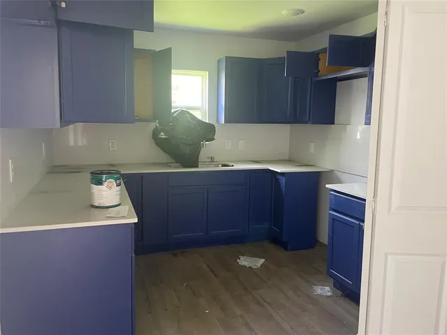 a view of cabinets with wooden floor