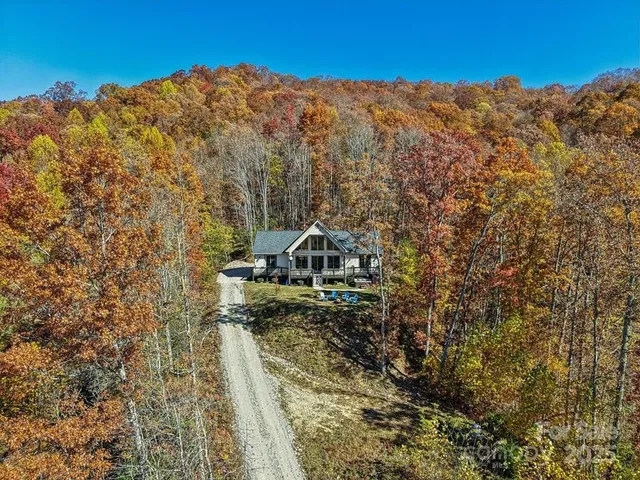 a view of a large mountain with a mountain in the background
