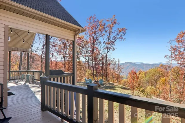 a view of a balcony with wooden fence and floor