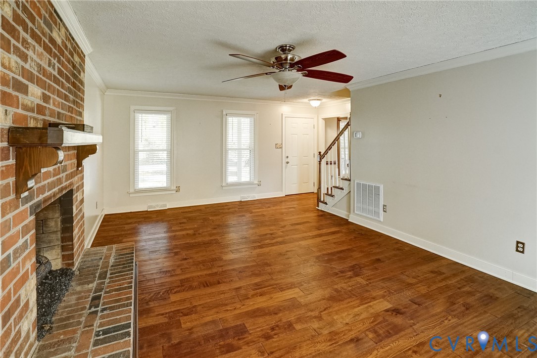 1253 Cardwell Road Crozier, VA 23039 - Photo 19 of 50 a view of an empty room with a window and wooden floor