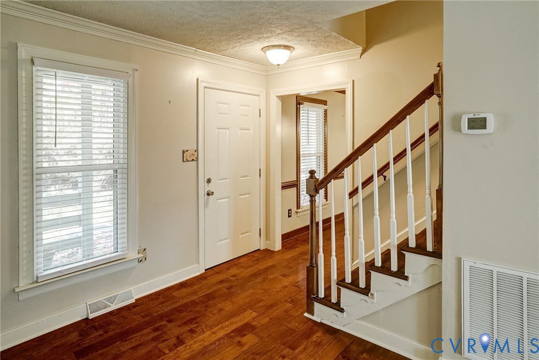 1253 Cardwell Road Crozier, VA 23039 - Photo 20 of 50 a view of entryway with wooden floor and stairs