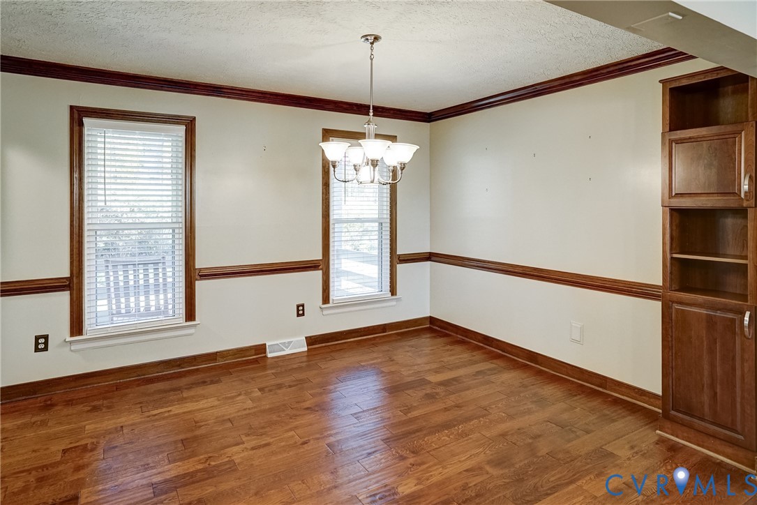 1253 Cardwell Road Crozier, VA 23039 - Photo 27 of 50 an empty room with wooden floor and windows