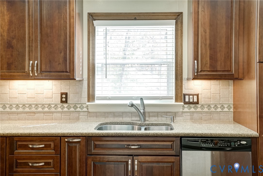 1253 Cardwell Road Crozier, VA 23039 - Photo 29 of 50 a kitchen with granite countertop a sink and a window