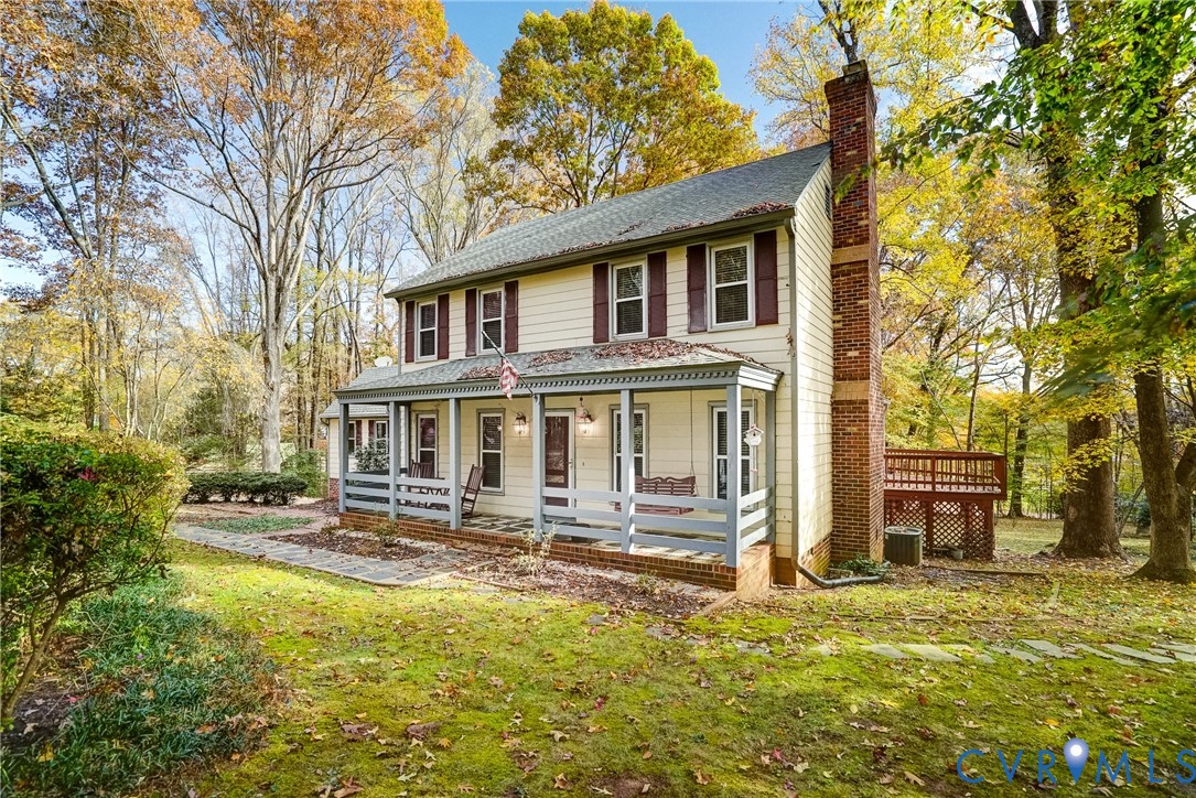1253 Cardwell Road Crozier, VA 23039 - Photo 3 of 50 a front view of a house with a yard table and chairs