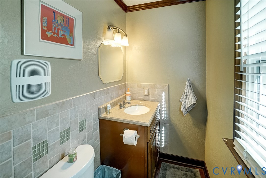 1253 Cardwell Road Crozier, VA 23039 - Photo 33 of 50 a bathroom with a sink mirror vanity and toilet