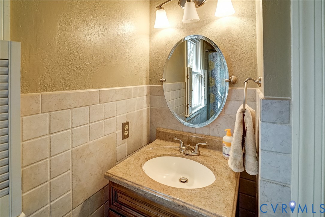 1253 Cardwell Road Crozier, VA 23039 - Photo 43 of 50 a bathroom with a sink mirror and toilet