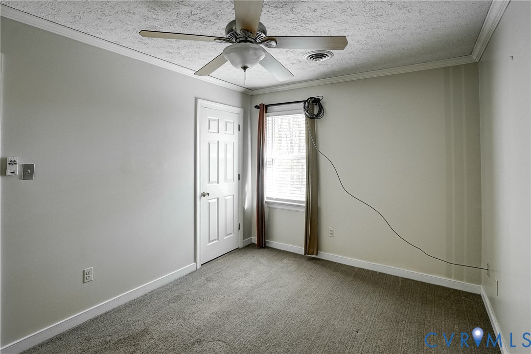 1253 Cardwell Road Crozier, VA 23039 - Photo 49 of 50 a view of a livingroom with a ceiling fan and window