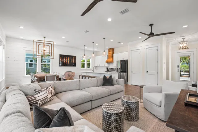 a open kitchen with stainless steel appliances granite countertop a sink a stove and a refrigerator