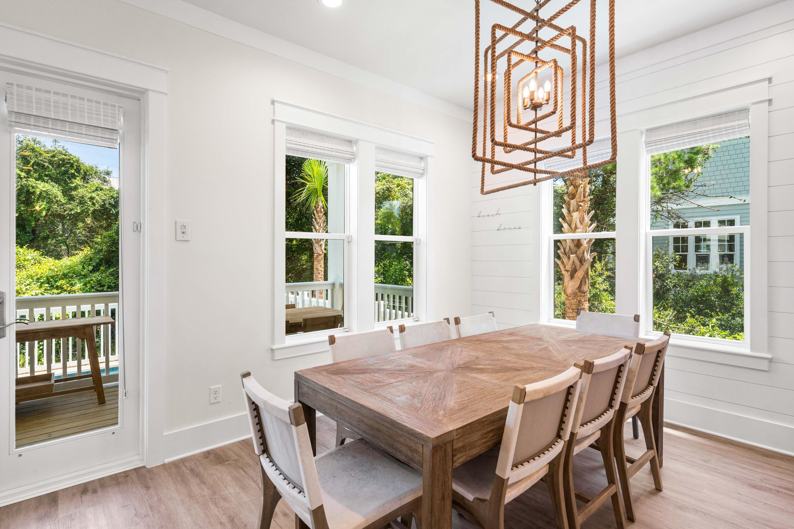 24 Barefoot Ln Inlet Beach Inlet Beach, FL 32461 - Photo 16 of 56 a view of a dining room with furniture window and wooden floor