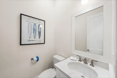 a spacious bathroom with a double vanity sink and a mirror