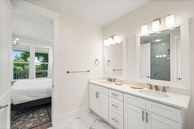 a view of a two chairs in the balcony