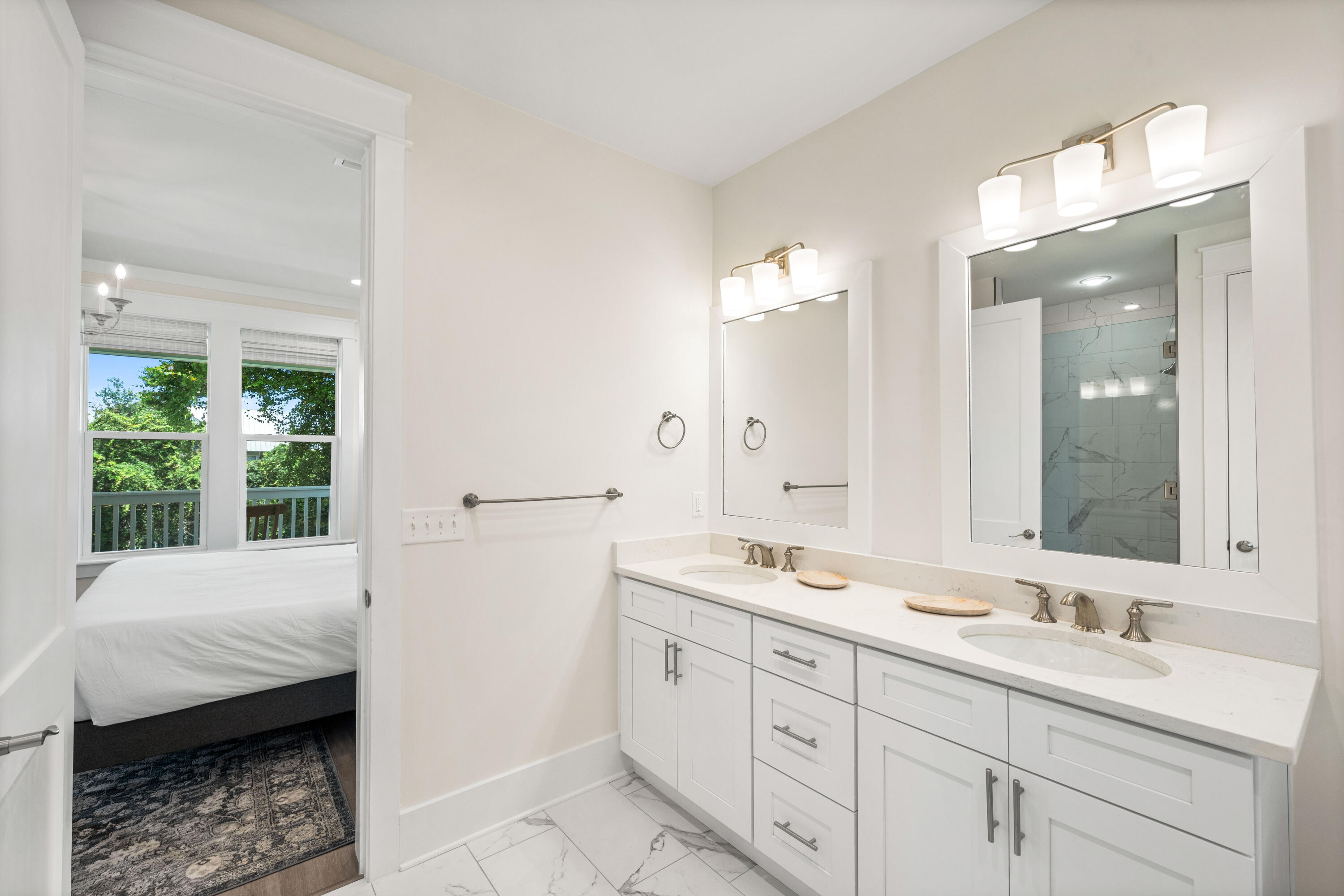 24 Barefoot Ln Inlet Beach Inlet Beach, FL 32461 - Photo 34 of 56 a en suite bathroom with a double vanity sink a mirror and a shower