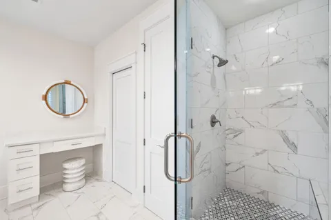 a kitchen with a sink and wooden floor