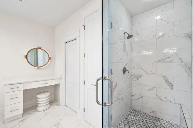 a kitchen with a sink and wooden floor