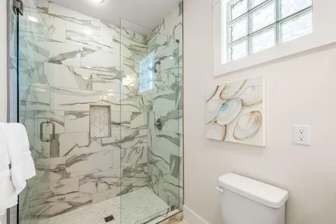 a bedroom with a bed and a mirror