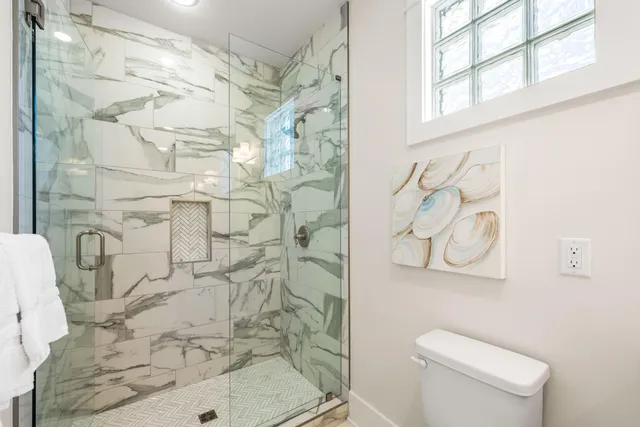 a bedroom with a bed and a mirror