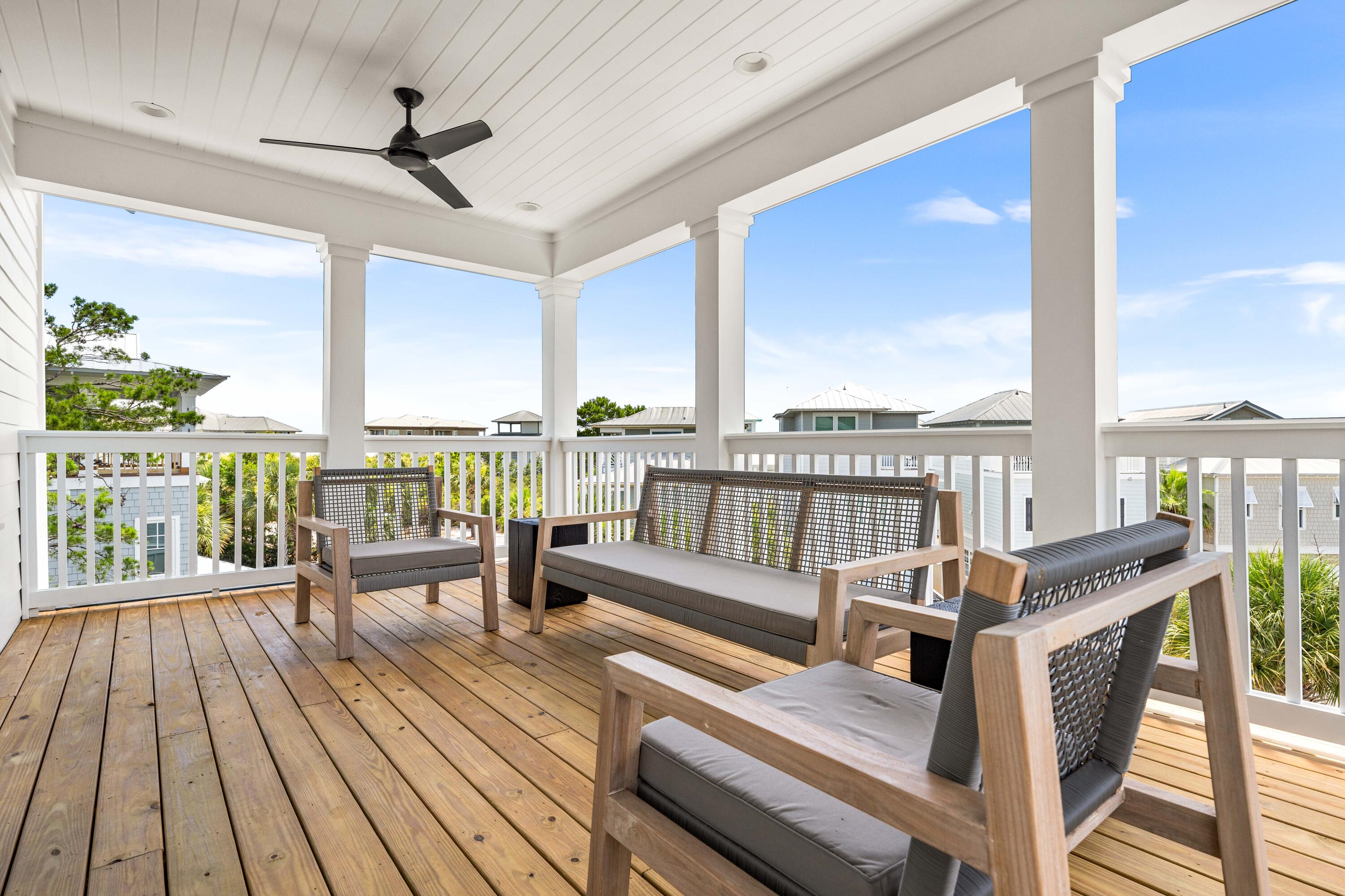 24 Barefoot Ln Inlet Beach Inlet Beach, FL 32461 - Photo 48 of 56 a living room with furniture and floor to ceiling windows