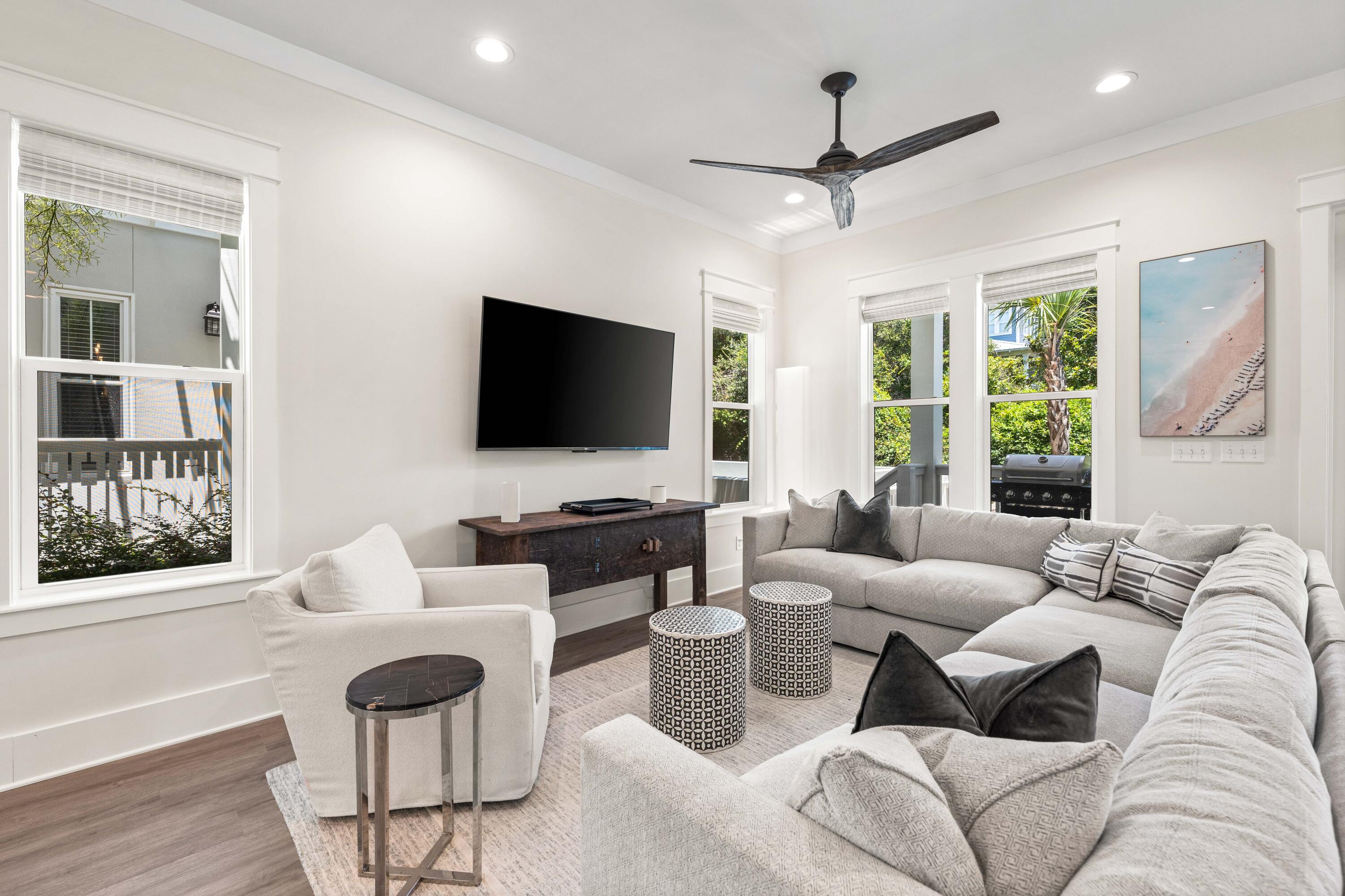 24 Barefoot Ln Inlet Beach Inlet Beach, FL 32461 - Photo 9 of 56 a living room with furniture a flat screen tv and a large window