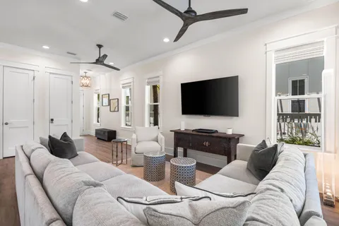 a large white kitchen with a large window