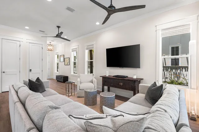 a large white kitchen with a large window
