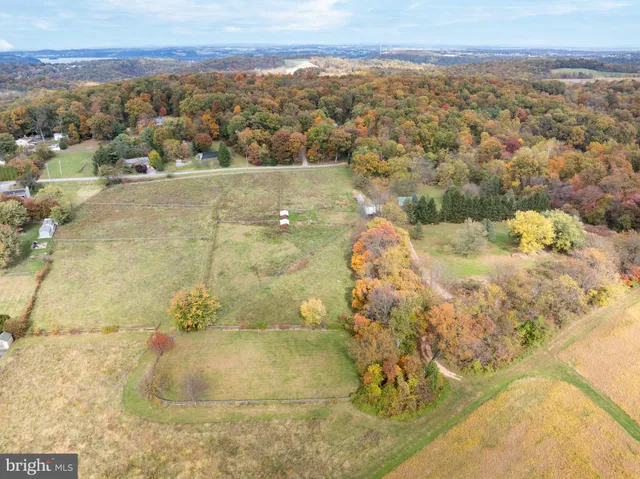 a view of a lake with a house in the background