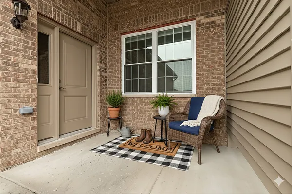 a front view of a house with outdoor seating