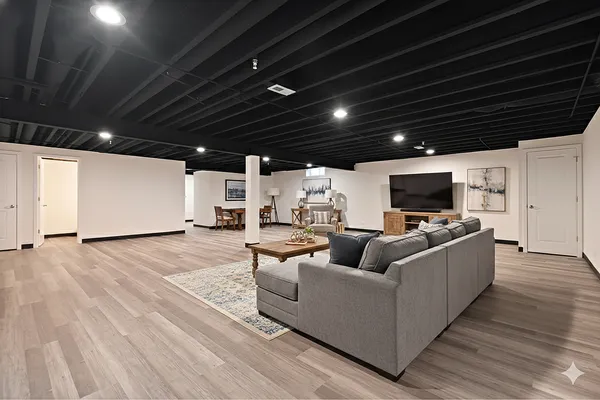 a living room with furniture and a flat screen tv