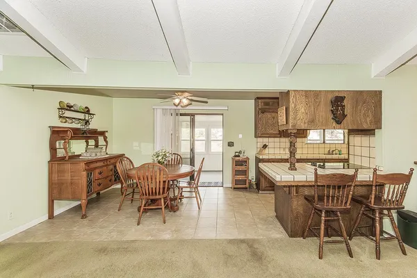 a dining room with furniture and window