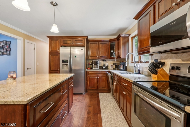 179 Mudtown Road Wantage, NJ 07461 - Photo 14 of 39 a kitchen with stainless steel appliances granite countertop a sink stove and refrigerator