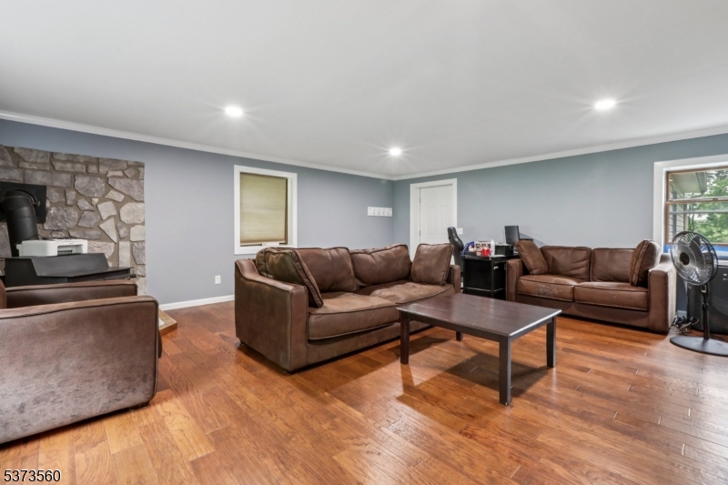 179 Mudtown Road Wantage, NJ 07461 - Photo 15 of 39 a living room with furniture and a wooden floor