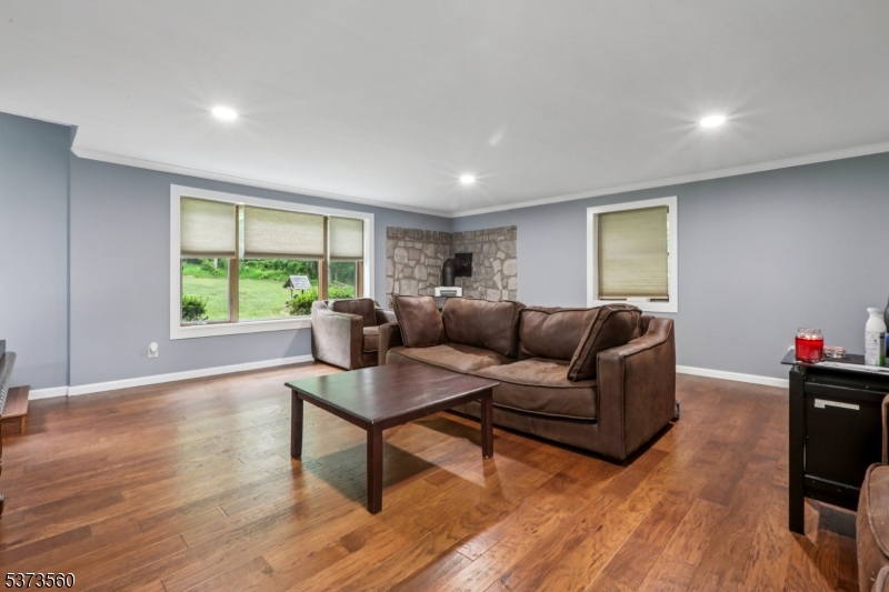 179 Mudtown Road Wantage, NJ 07461 - Photo 16 of 39 a living room with furniture and a wooden floor