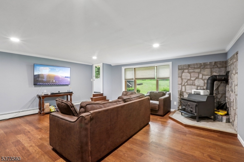 179 Mudtown Road Wantage, NJ 07461 - Photo 17 of 39 a living room with furniture and a flat screen tv