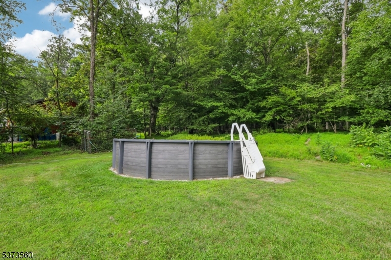 179 Mudtown Road Wantage, NJ 07461 - Photo 35 of 39 a view of a backyard with large trees