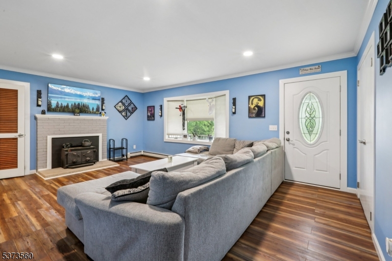 179 Mudtown Road Wantage, NJ 07461 - Photo 4 of 39 a living room with furniture and a fireplace