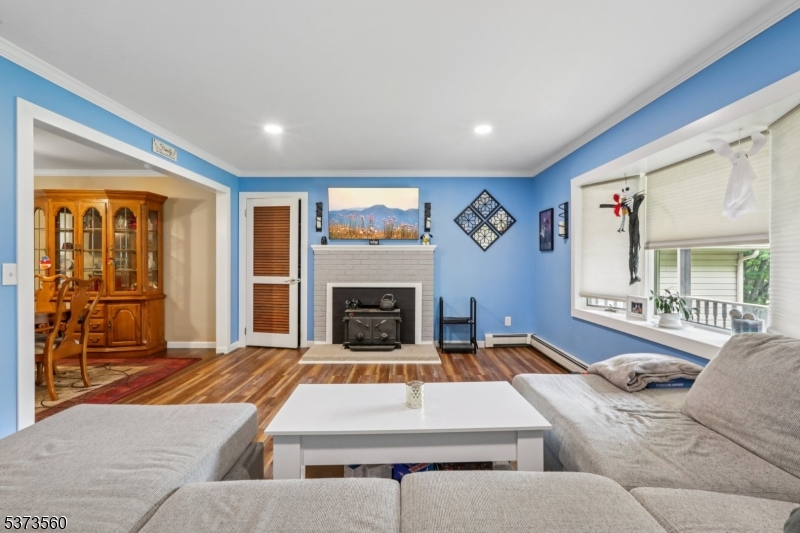 179 Mudtown Road Wantage, NJ 07461 - Photo 5 of 39 a living room with furniture and a fireplace