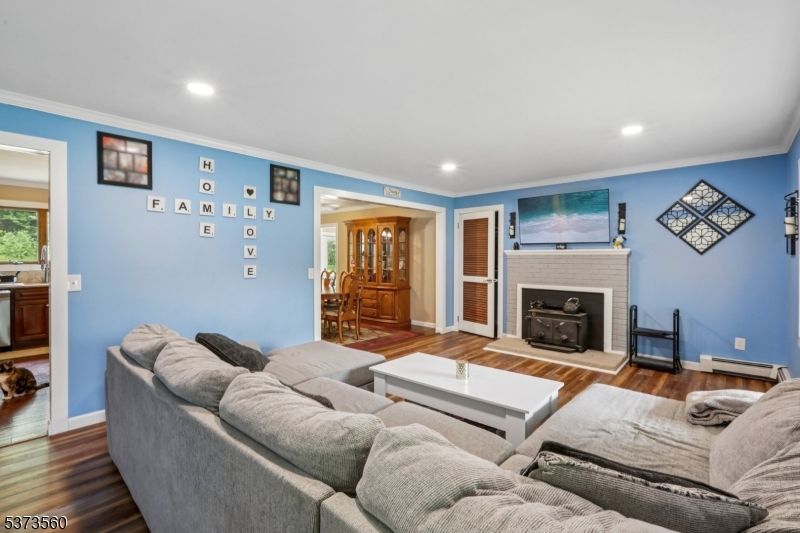 179 Mudtown Road Wantage, NJ 07461 - Photo 6 of 39 a living room with furniture and a fireplace