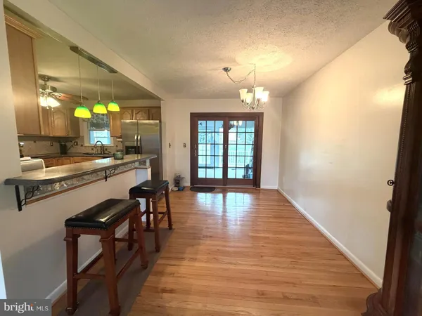 a view of a kitchen and dining room