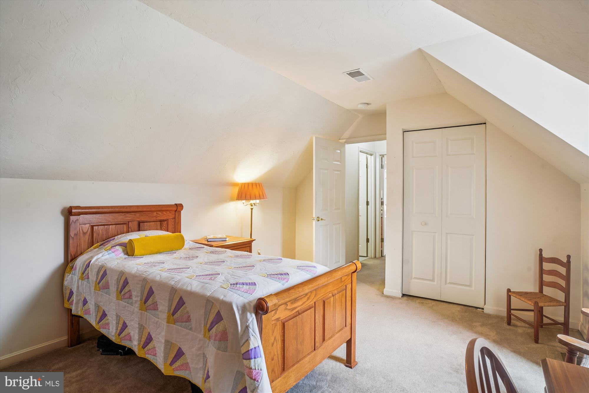 191 Marion Road Westminster, MD 21157 - Photo 22 of 38 a bedroom with a bed a dresser and chair