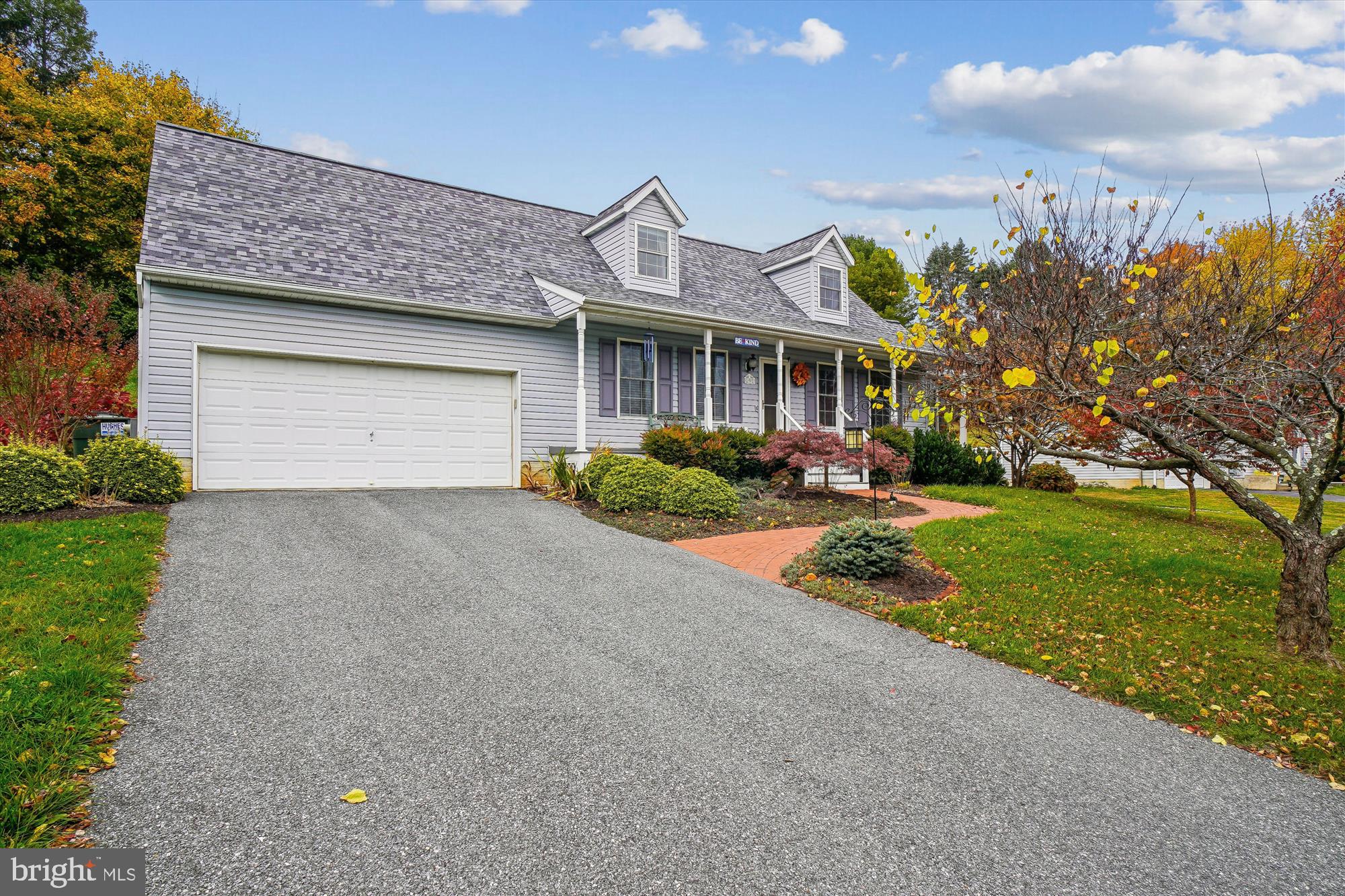 191 Marion Road Westminster, MD 21157 - Photo 3 of 38 a front view of a house with a yard and garage