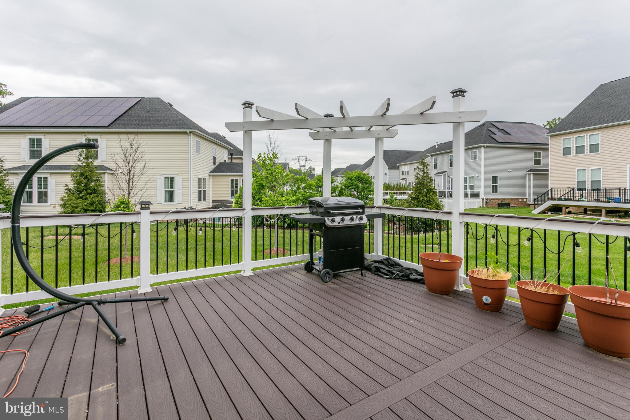 22800 Bubbling Brook Drive Brambleton, VA 20148 - Photo 12 of 64 a view of a deck with furniture and garden